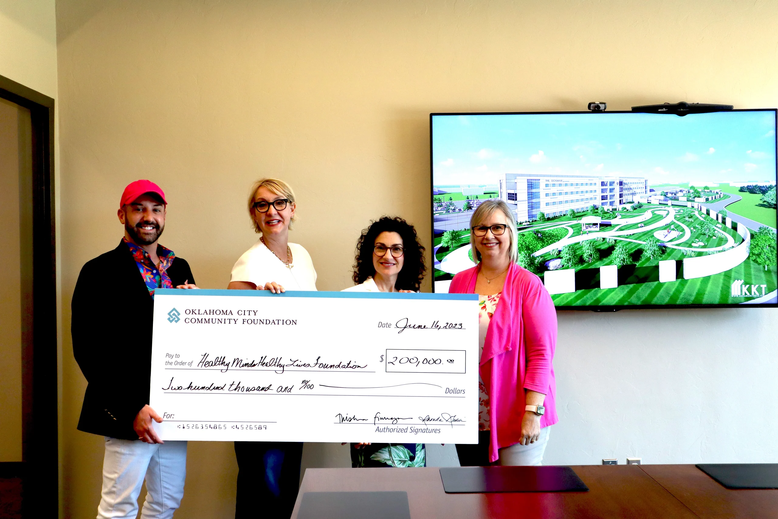 OCCF’s Trisha Finnegan, Kelley Barnes and Shree Ledford present a check to Oklahoma Department of Mental Health’s Heath Hayes for the Healthy Minds Healthy Lives Foundation.